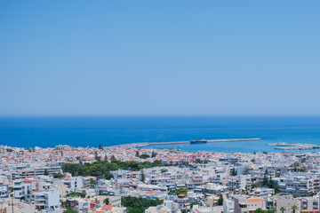 Panoramic view of the Greek city of Rethymno from a height on the island of Crete Greece. Residential buildings and the Aegean sea