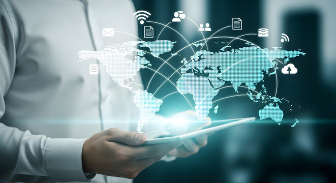 Man in White Shirt Holds Tablet Showing Digital World Map with Glowing Network Icons Over Gray Background