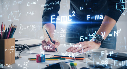 Man Writes Math Formulas on White Table with Floating Equations And Pencils In Bright Office Studio