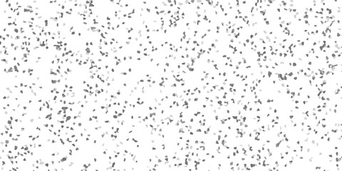 Abstract background design featuring scattered geometric shapes with varying shades of grey on a white background