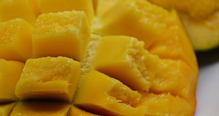 fresh mango fruit in a plate cut it slide