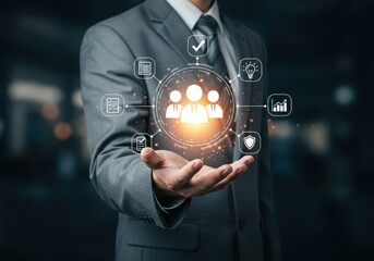 Businessman holding a digital globe of people and business icons