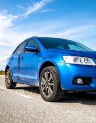 Obraz premium Blue car on a road