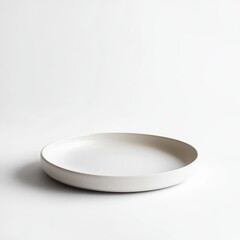 Minimalist ceramic plate with textured rim on a white background