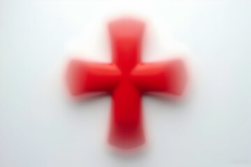 Obraz premium Abstract Red Cross Shape on White Background with Motion Blur