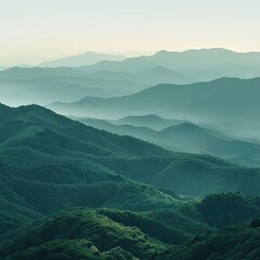 Fototapeta premium Misty green mountain range at dawn; scenic vista, peaceful landscape; nature background, travel poster