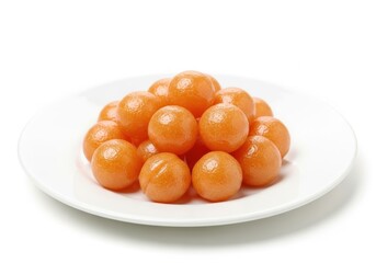 Pile of glistening orange melon balls, a refreshing summer indulgence