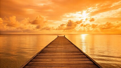 A tranquil and captivating view of a wooden pier extending into a calm sea at sunset. The sky and water are bathed in a warm, vibrant orange and yellow glow