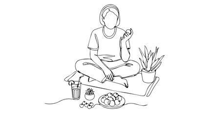 Woman sitting cross-legged on mat enjoys healthy snack. Detoxifying lifestyle includes fresh fruit, vegetables, and juice.