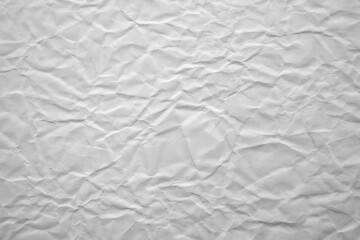 Crumpled White Paper Texture Displayed in a Detailed Close-Up Capturing Intricate Wrinkles and Creases