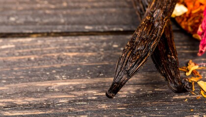 Close-up of dried vanilla pods on wood