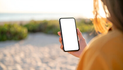 Woman Holding Phone with Beach Sunset.