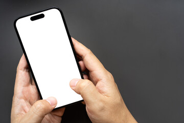 Hand Holding Smartphone with Blank White Screen on Dark Background. Perfect for mockups, app presentations, and digital marketing concepts.