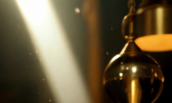 golden pendent bell hanging with dark background.ai 