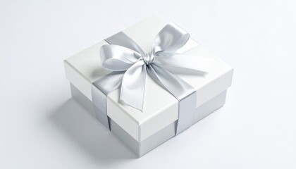 Obraz premium White gift box with ribbon mockup isolated on white for product packaging and promotional design