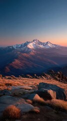 Mountain vista at dawn.  Sunrise over snow-capped peaks