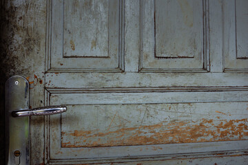 Weathered Wooden Door with Chrome Handle and Detailed Texture