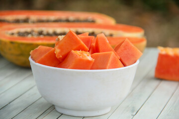 Slices of papaya or Carica papaya arranged in a white bowl, a bowl of sliced papaya ready to be served