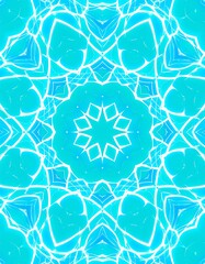 Intricate teal and white symmetrical pattern