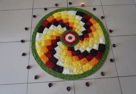 pookalam designs for onam celebrations , pookalam made for part of onam celibration in kerala, india. it also referred to as athapookalam, is often made in a circular shape with flowers on floor