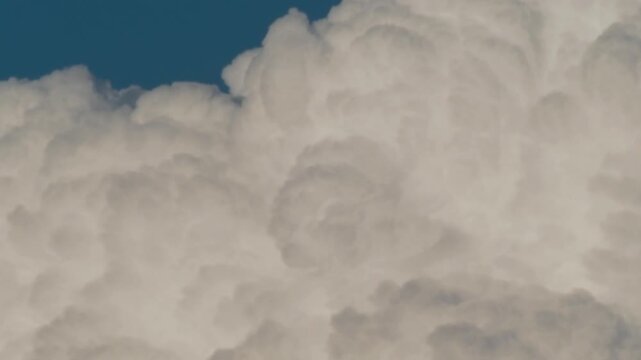 Tokyo, Japan - August 8, 2025: Quickly Moving cumulonimbus cloud or thunderhead on blue sky background in summer