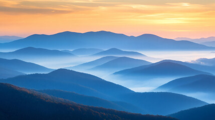 Fototapeta premium Misty mountain range at sunrise.