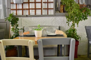 European outdoor cafe restaurant dining tables and chairs bench in Rethymno Crete Greece