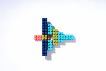 Fototapeta premium Abstract Arrow Shape Made of Colorful Building Blocks
