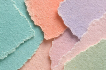 Macro Close-Up of Torn Pastel Paper Collage with Deckled Edges