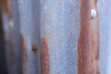 Close-up of rusty zinc texture with natural corrosion patterns.Old Zinc wall rust background or texture.