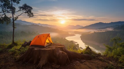 Glowing Orange Tent on Giant Tree Stump – Sunrise over River with Lush Forest and Misty Mountains