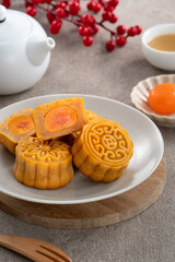 Traditional Cantonese moon cake with salted egg yolk filling and lotus seed paste.