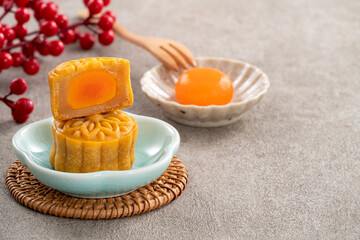 Traditional Cantonese moon cake with salted egg yolk filling and lotus seed paste.