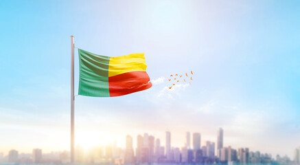 Benin national flag waving with skyline and buildings. A beautiful view of flag with skyline.