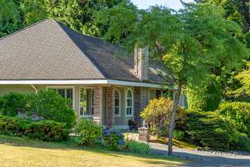 Two story luxury house with beautiful summer  landscape in Vancouver, Canada, North America. Day time on August 2025.