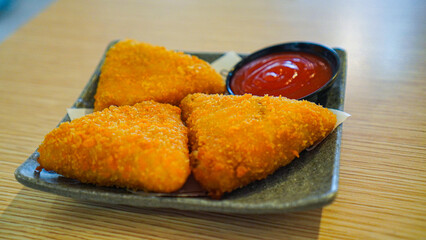 Indonesian snack Crispy breaded called Risol Mayo with tomato ketchup dipping sauce