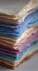 Close-up of stacked, colorful handmade papers