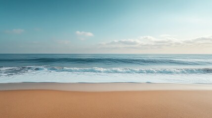 Ocean waves gently washing onto the sandy beach