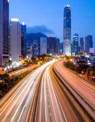City highway at twilight, light trails of speeding cars