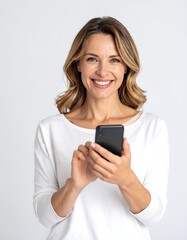Fototapeta premium Happy woman smiling, holding smartphone