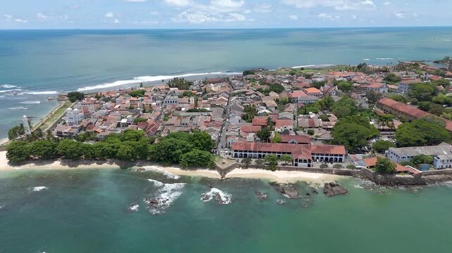 4K drone footage showcasing Galle Fort and the beautiful Sri Lankan coastline showcasing the historic streets, the iconic lighthouse, and sweeping ocean views from above.