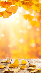 秋の黄色い葉のフレームとゴールドぼかし背景