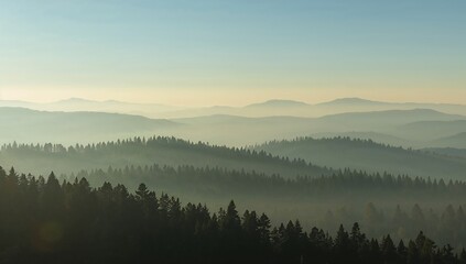 Fototapeta premium Mountains Silhouette with Fog: Majestic mountains shrouded in a delicate veil of mist create a serene and breathtaking panorama, highlighting the harmony of nature.