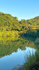 Fototapeta premium Natural photography, trees, lake and mountain reflection