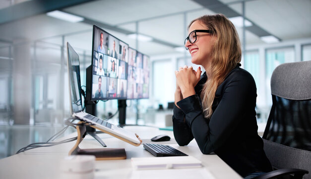 Young Woman Using Laptop For Virtual Conference