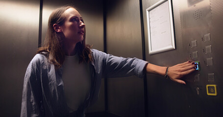Woman Experiencing Agoraphobic Panic Attack Trapped Inside Small Elevator © Andrey Popov