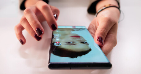 Woman Scrolls Through Media Content On Her Smartphone, Swiping Short Videos