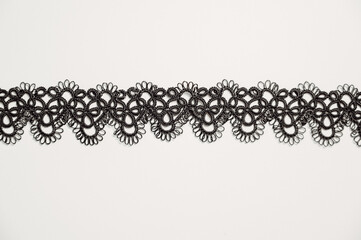 Closeup texture of Necklace or bracelet made with Tatting or frivolite concept.Copy space banner 