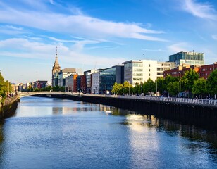 Naklejka premium Riverfront cityscape on a sunny day, buildings lining the water's edge with reflections