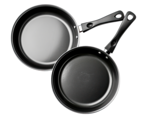 Two round black frying pans, one atop the other,  showing smooth surfaces and dark handles